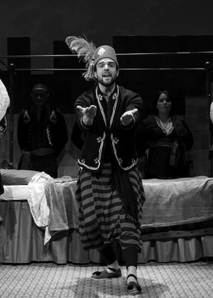 Theater performance with actors and props, possibly for a kids' show.