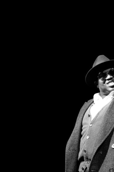 Mr. Chickee, wearing a hat and sunglasses, gives an "OK" sign.