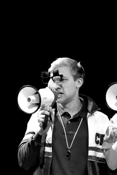 Two counselors at Camp Kappawanna, wearing novelty glasses and holding megaphones.