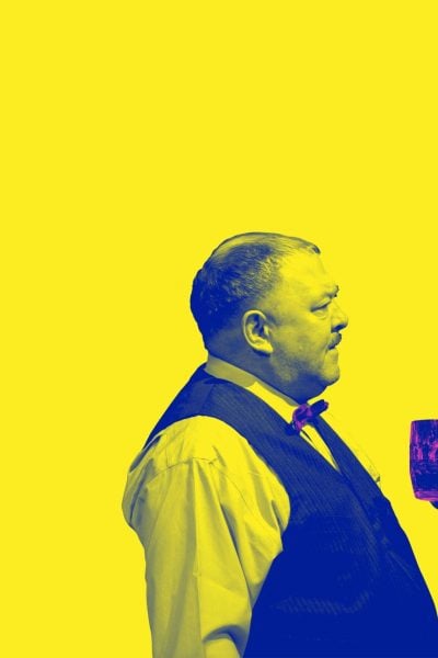 Two men, one holding a drink, in profile view against a yellow background.