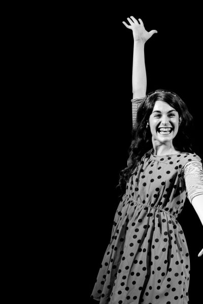 Two joyful girls in retro dresses, celebrating. Ivy + Bean musical.