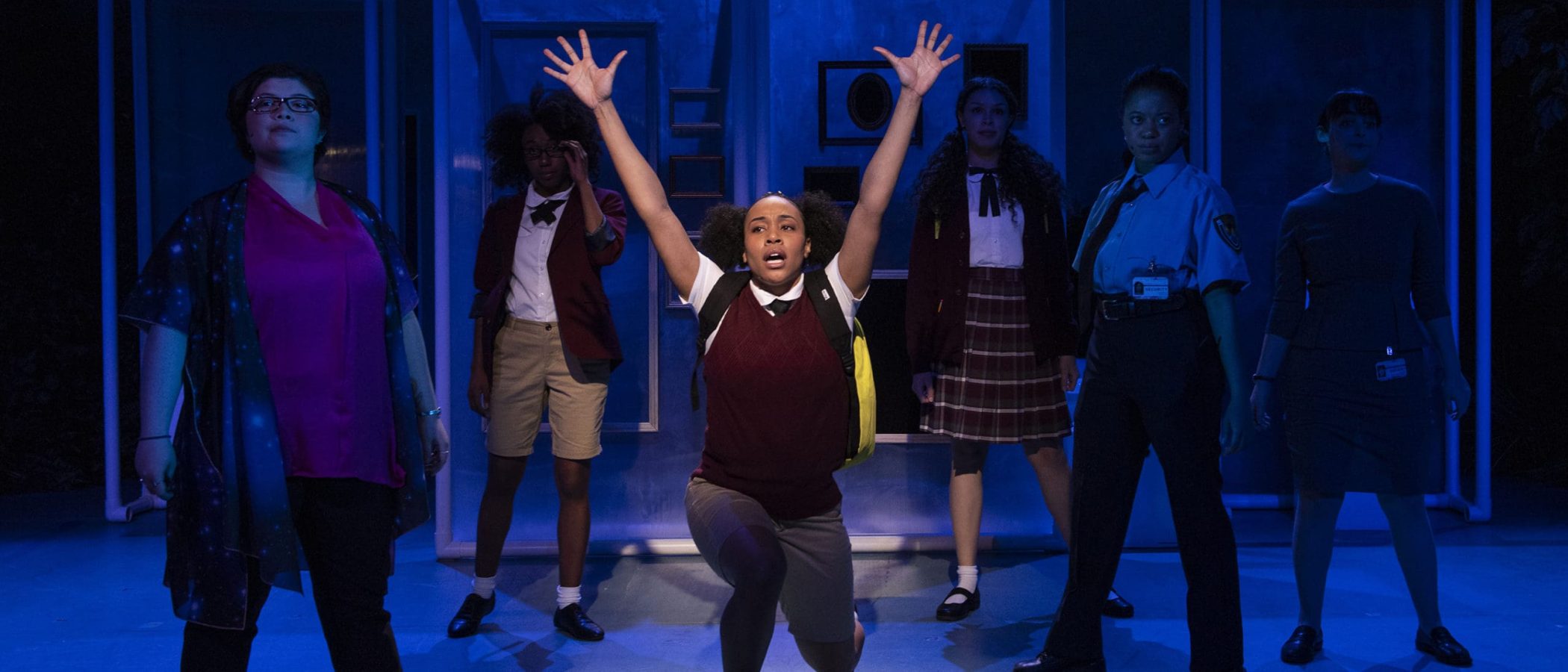 Cast of "She Persisted," the musical, in a dramatic stage scene.