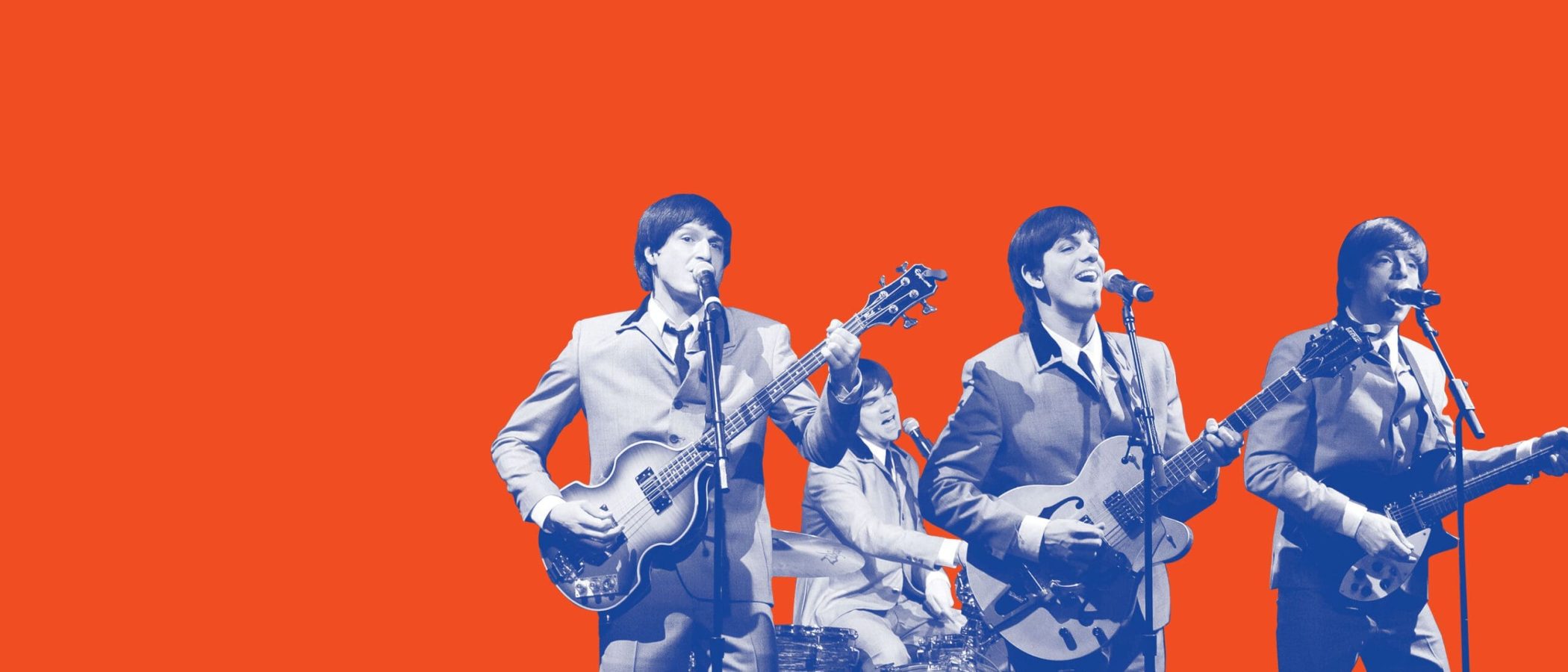 The Quarto, a Beatles tribute band, performs on stage. "The Quarto" is visible on an amplifier.