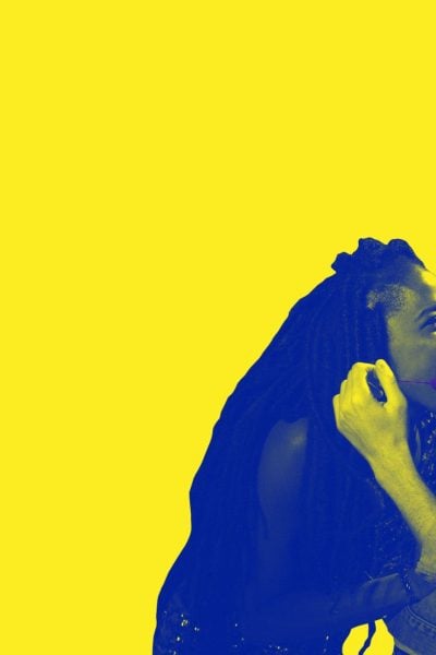 Two people arguing intensely, a woman with dreadlocks and a man with curly hair. This ain't no disco.