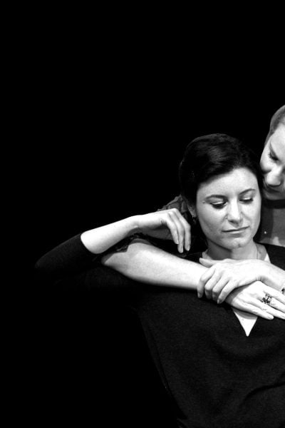 Two women embracing, one comforting the other. Women or Nothing.