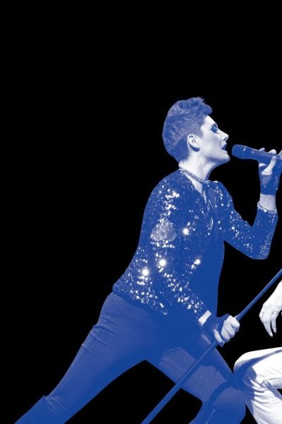 Alice's Rock & Roll Wonderland: A female vocalist and a guitarist perform on stage.