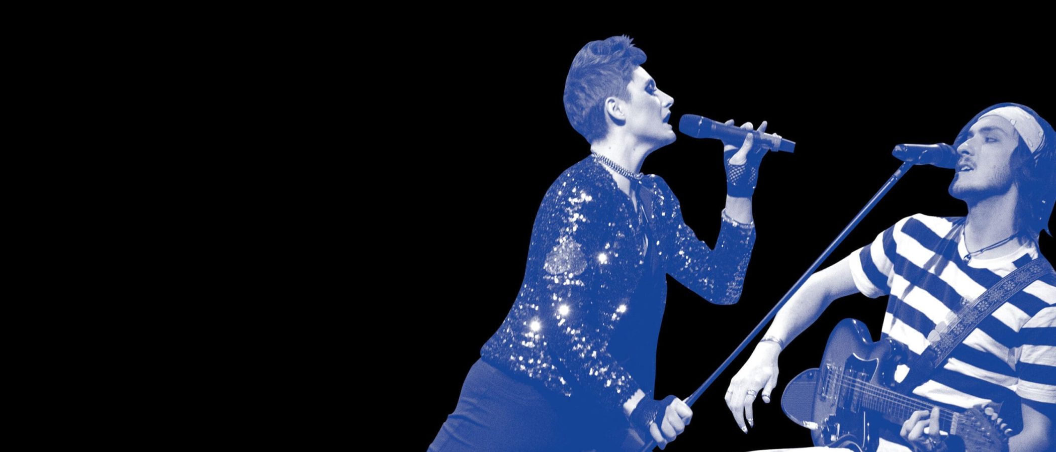 Alice's Rock & Roll Wonderland: A female vocalist and a guitarist perform on stage.