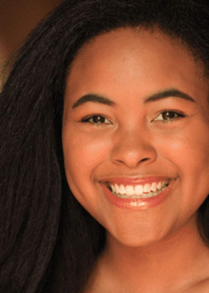 Jessenia Ingram smiling, looking directly at the camera