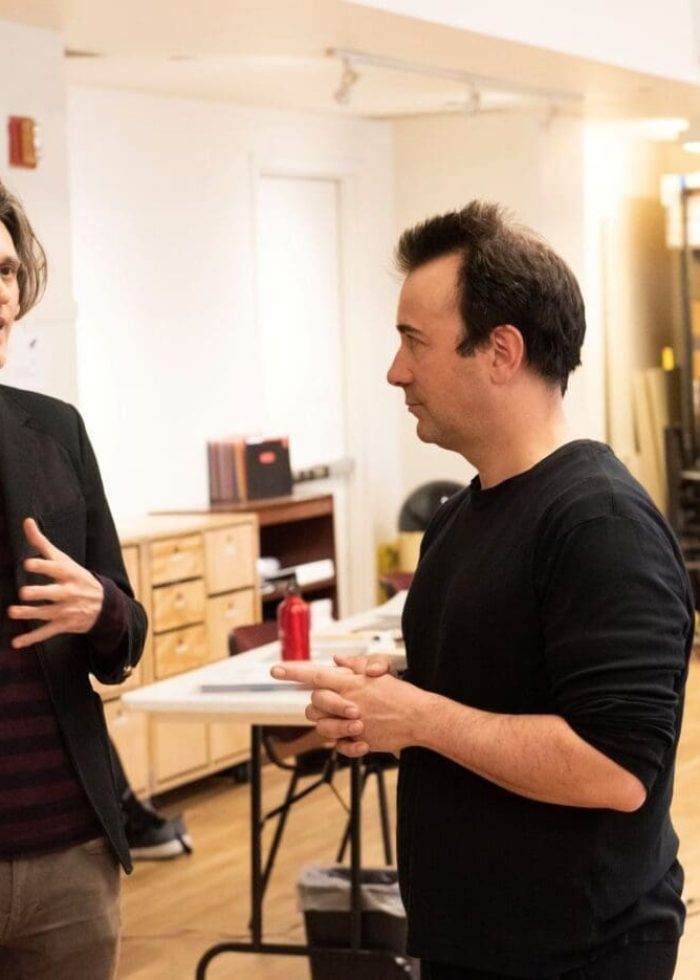 Lucas Hnath speaking with Kally Patz in a rehearsal space.