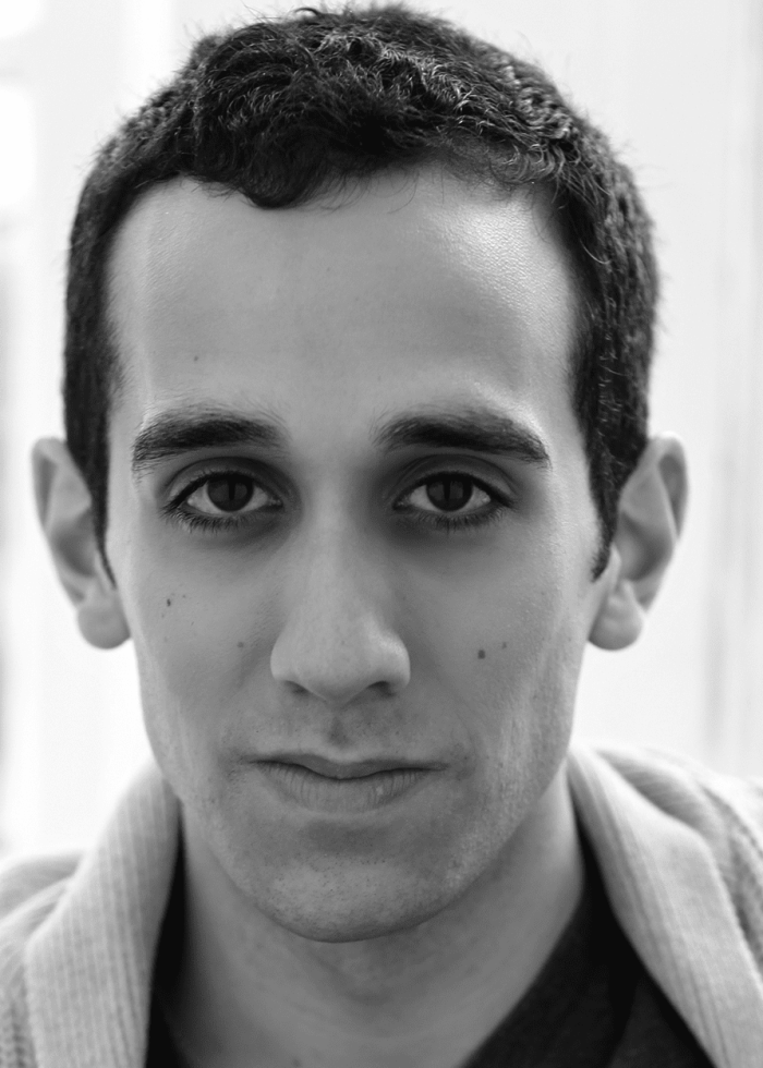 Close-up portrait of George Abud looking directly at the camera