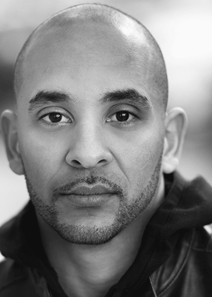 Victor Almanzar, headshot in black and white