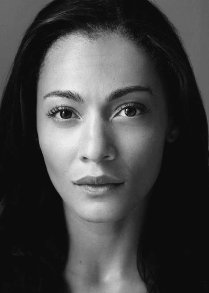 Amelia Workman, portrait in black and white, looking directly at the camera.