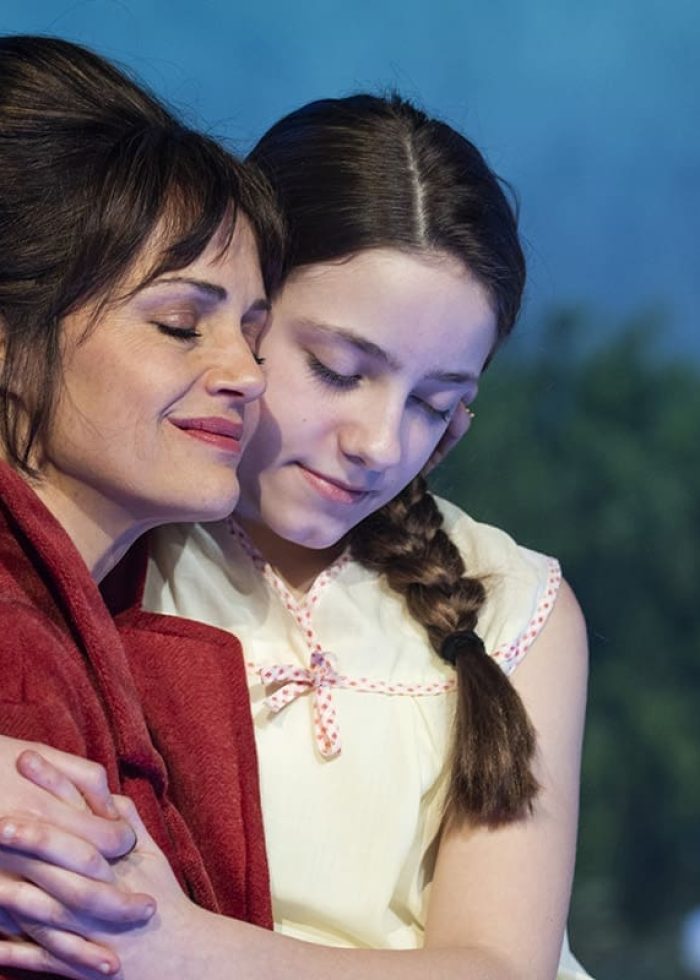 Mother and daughter embrace in a scene from "Anatomy of a Suicide" play