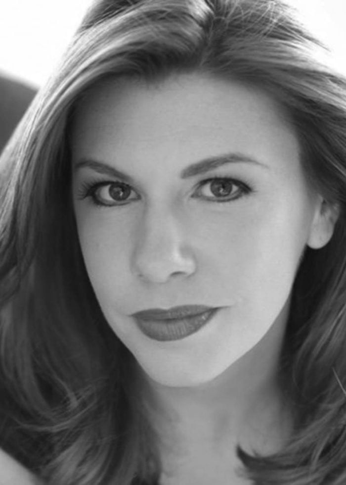 Andrea Syglowski, headshot portrait in black and white