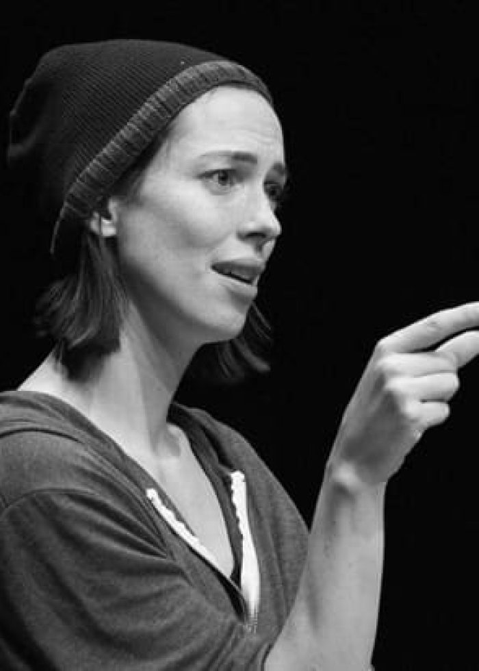 Rebecca Hall in "Animal" theatrical performance, pointing and speaking.