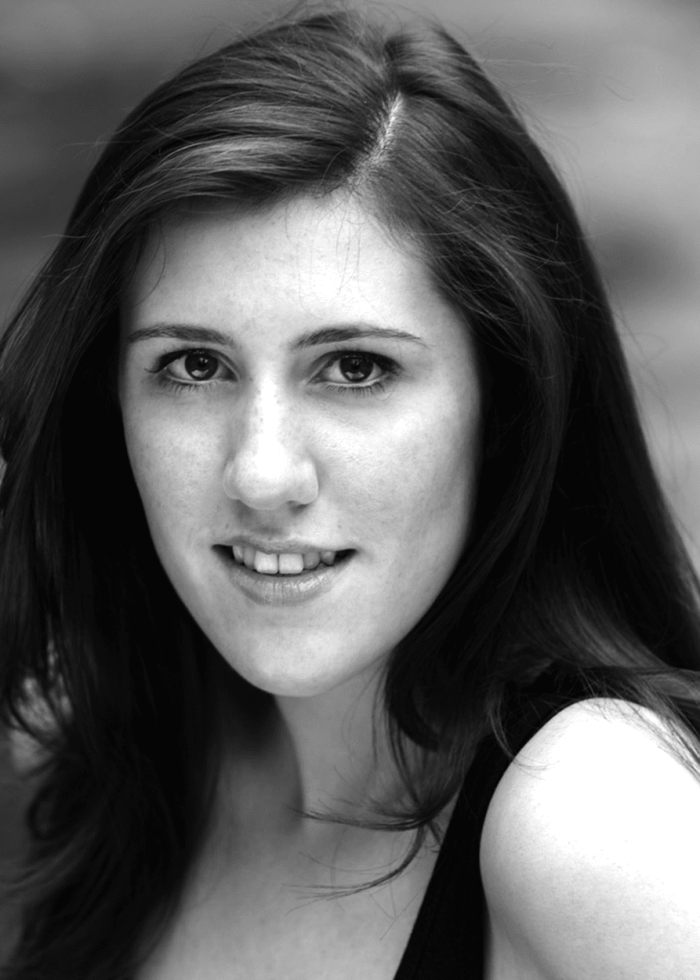 Anna Chicco portrait: Young woman with dark hair looking at the camera