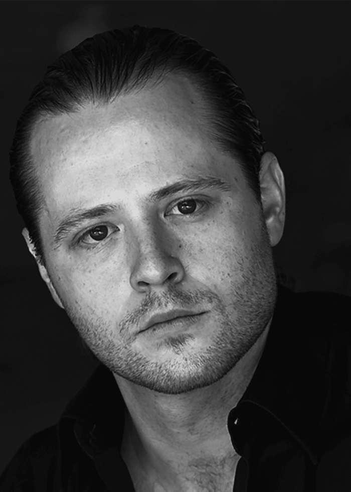 Headshot of William Apps, looking directly at the camera.