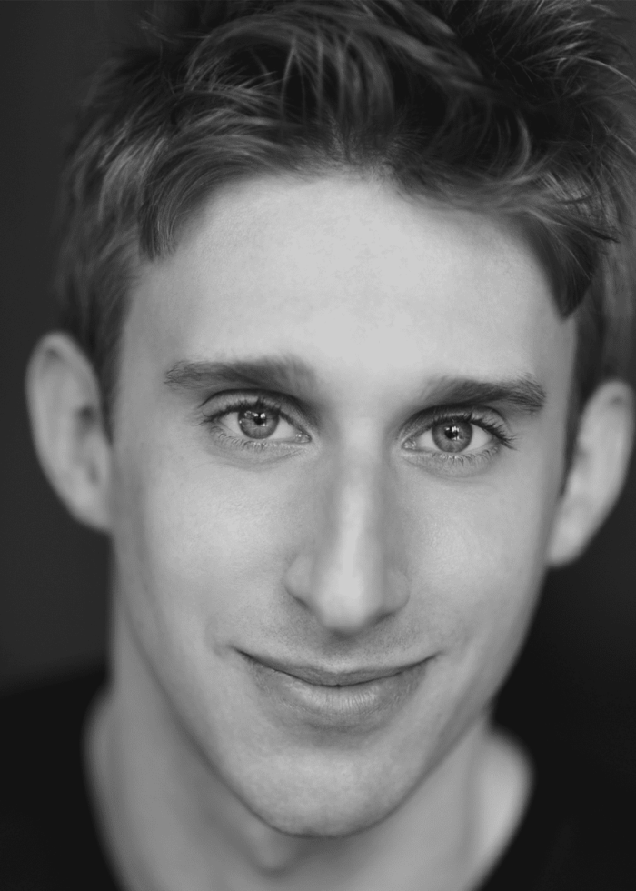 Close-up portrait of Bill Army smiling at the camera.