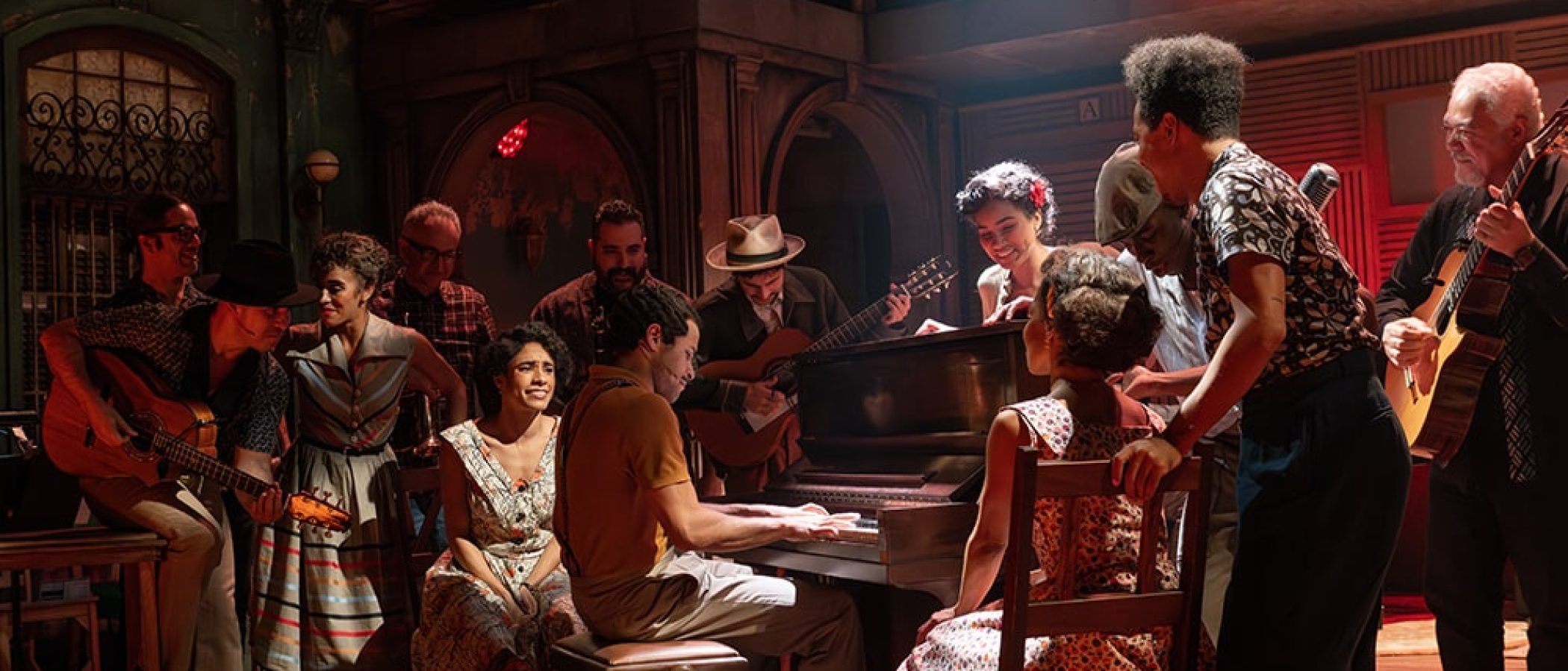 a group of people around a piano