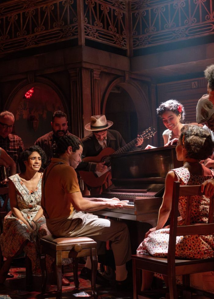 Buena Vista Social Club musical cast performing on stage with piano and guitars