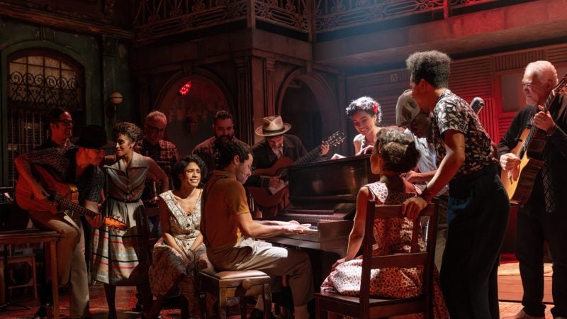Buena Vista Social Club musical cast performing on stage with piano and guitars