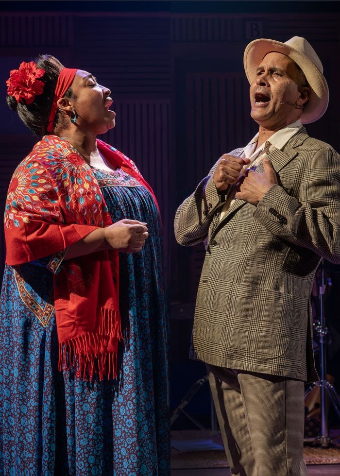 Two singers perform a duet, reminiscent of the Buena Vista Social Club's style.