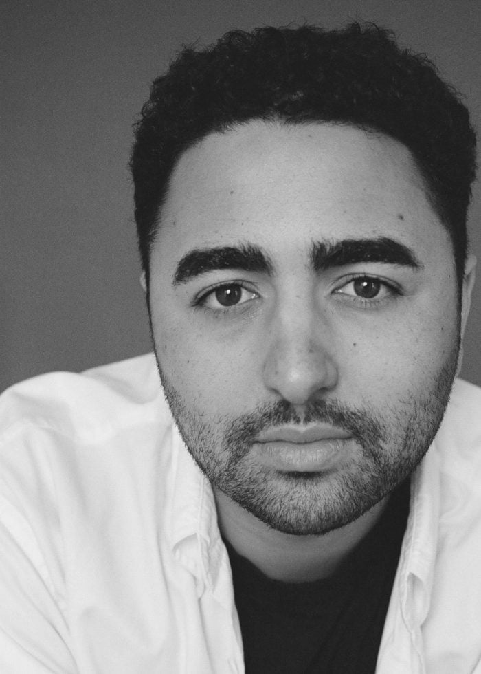 Jacob Basri in a black and white portrait, looking directly at the camera.