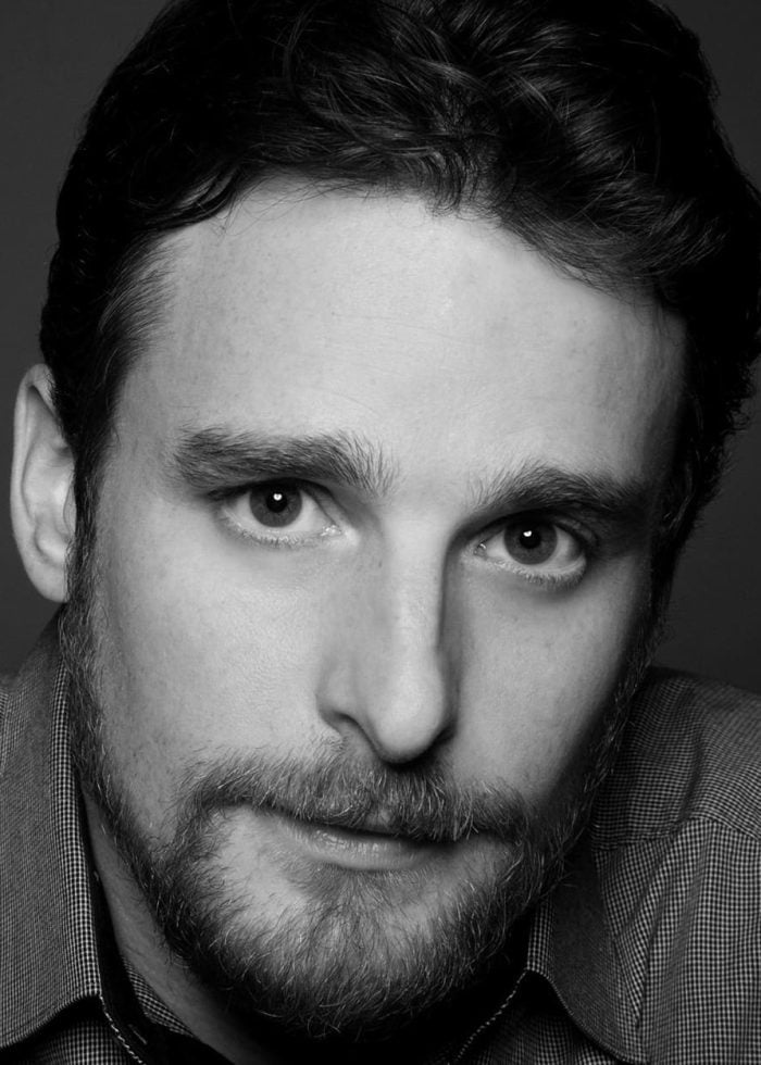 Close-up portrait of Bill English, wearing a button-down shirt, looking directly at the camera.