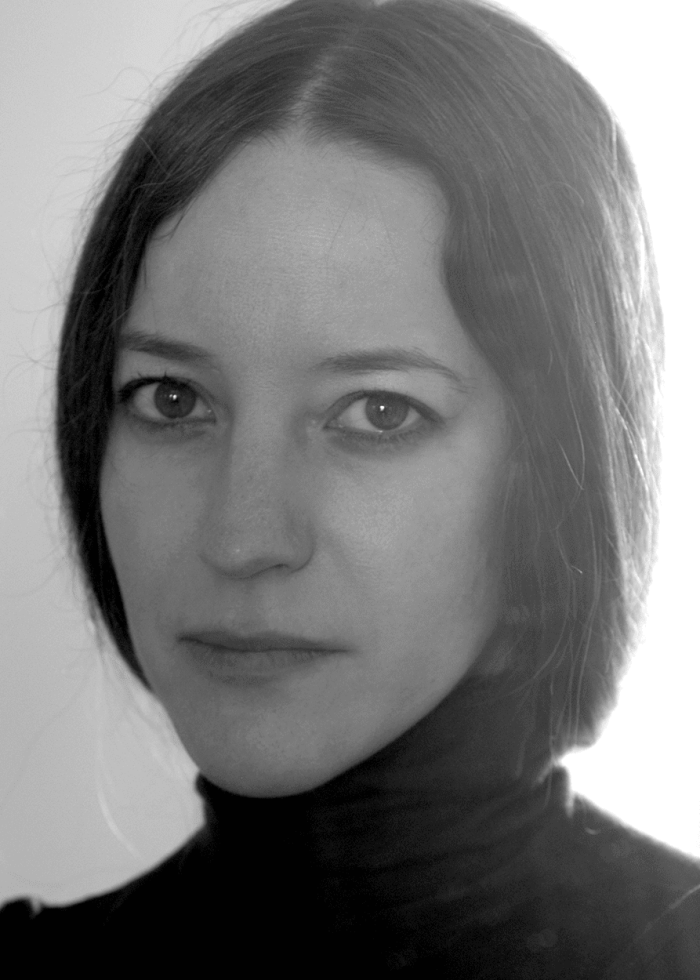Brooke Bloom, portrait in black and white, wearing a black turtleneck