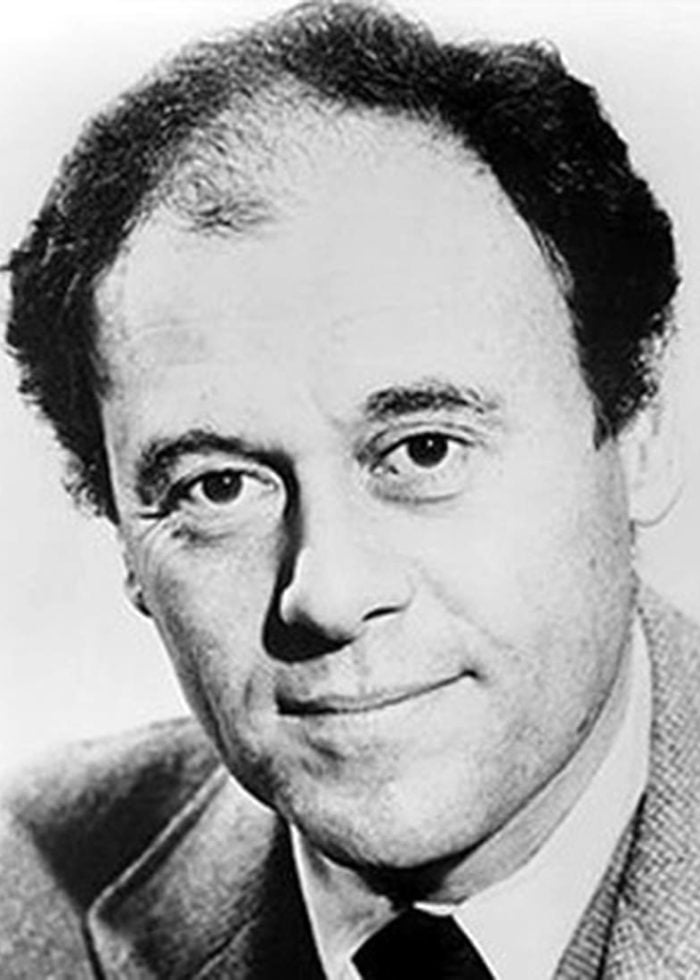 Bob Dishy, actor, in a black and white headshot, smiling at the camera.