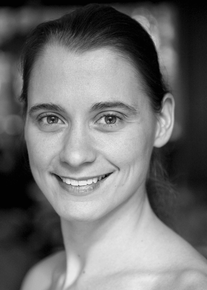 Sophie Bortolussi smiling, close-up portrait in black and white