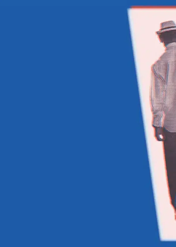 Silhouette of a man in a hat walking with a briefcase, potentially related to Buena Vista Social Club musical.