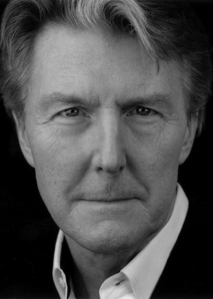 Byron Jennings portrait, close-up in black and white.