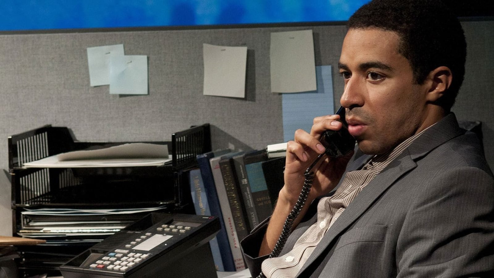 Businessman on phone call at office desk