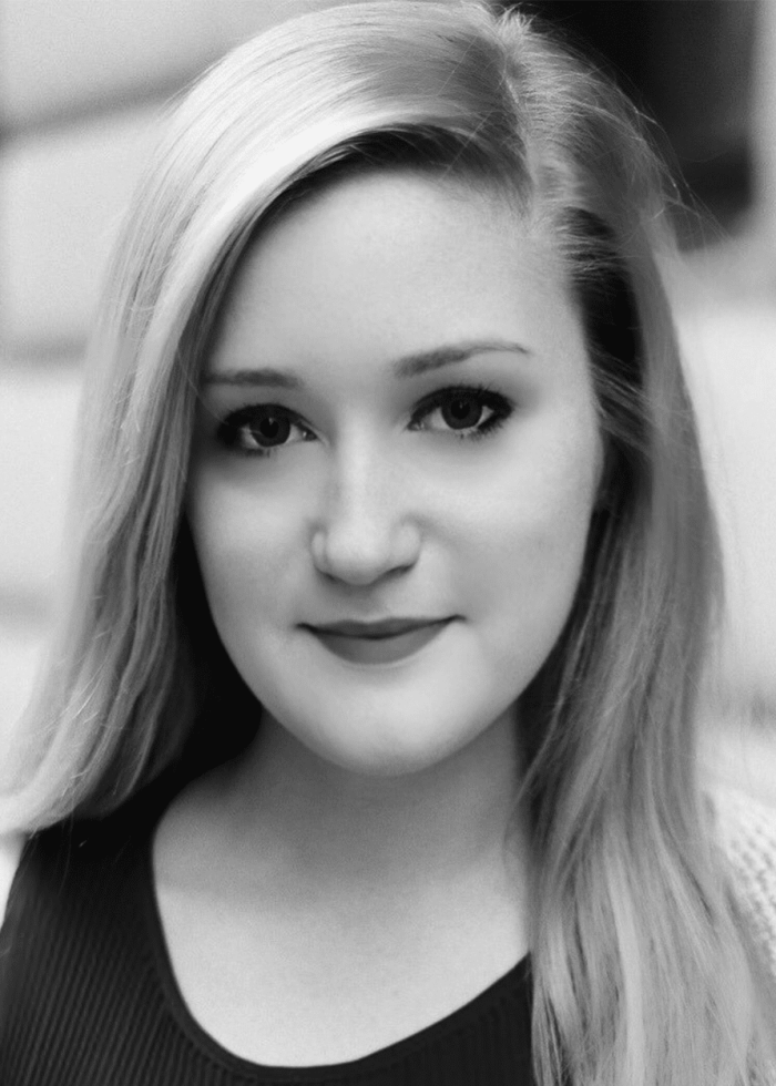 Caitlin Donohue portrait, blonde hair, looking at the camera