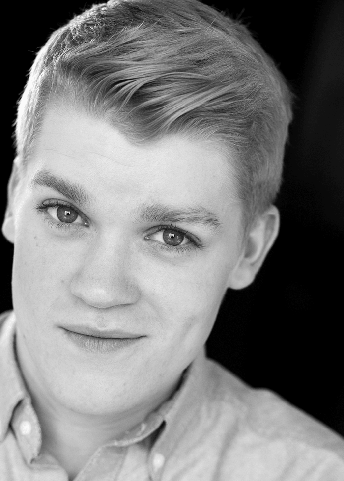 Headshot of Chris Renalds, with a slight smile, looking at the camera.