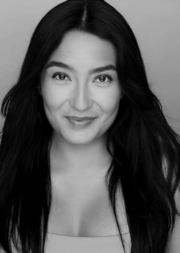 Headshot of Christian Adriana Johannsen with dark hair, smiling