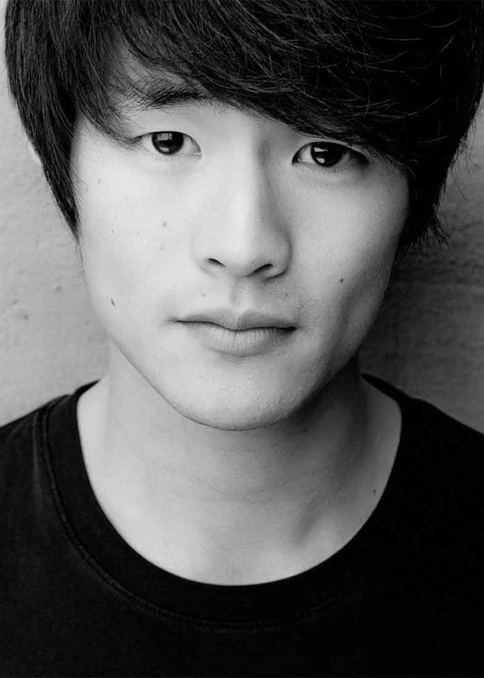 Close-up portrait of Christopher Larkin, looking directly at the camera.