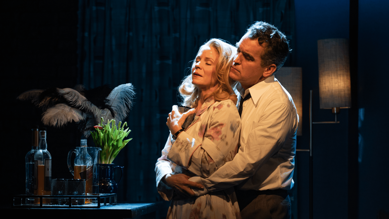 A man and woman embrace intimately in a dimly lit room, suggesting a scene from "Days of Wine and Roses".