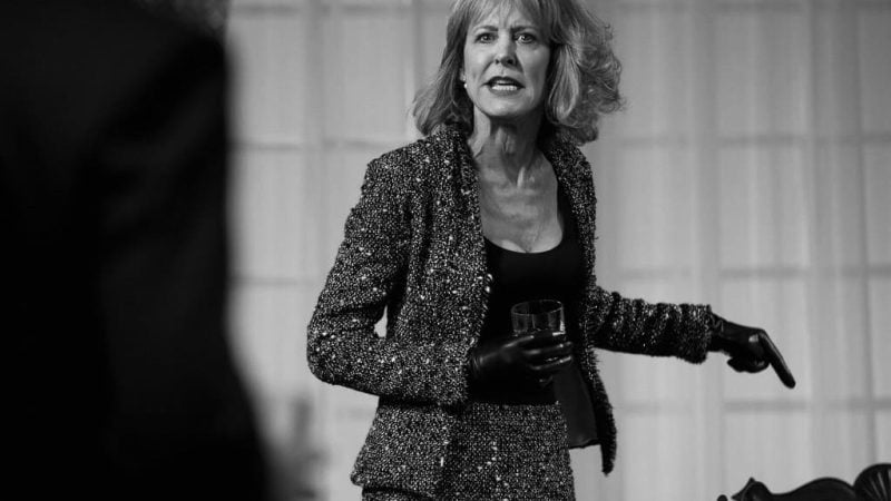 Woman in a tweed suit gestures during a dramatic scene. The blog title is "Dreams of Flying Dreams of Falling.