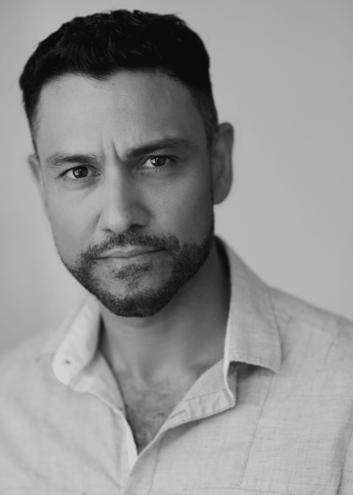 Sanjit de Silva, actor, looking directly at the camera