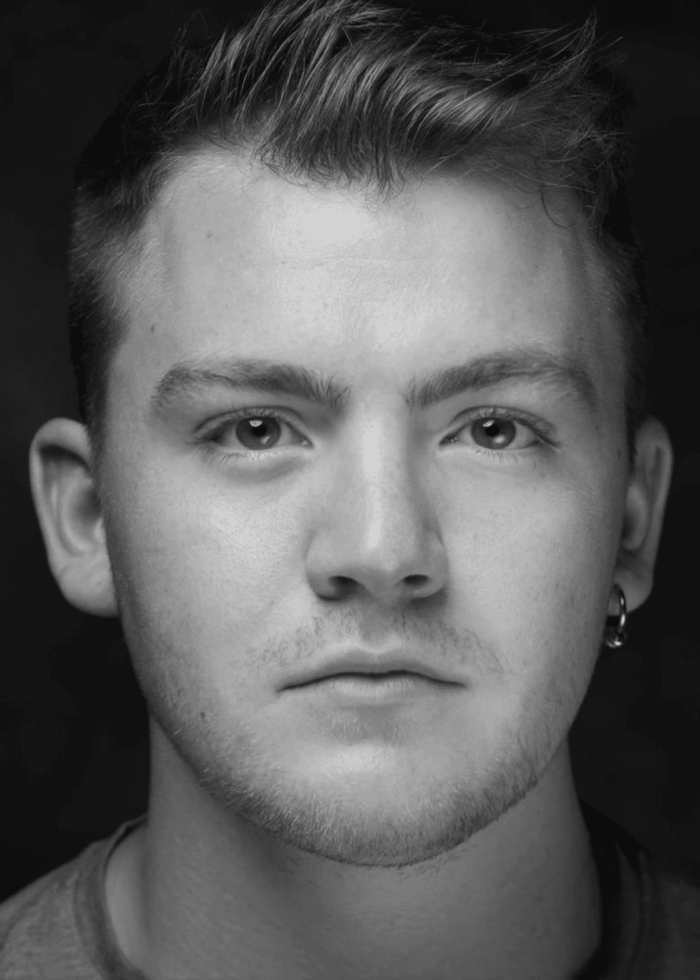 Portrait of Jack DiFalco, a young man with short hair and a serious expression.