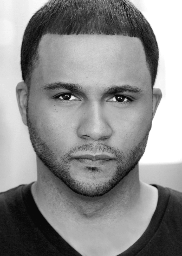 Headshot of Jason Dirden with a focused expression and well-groomed beard.