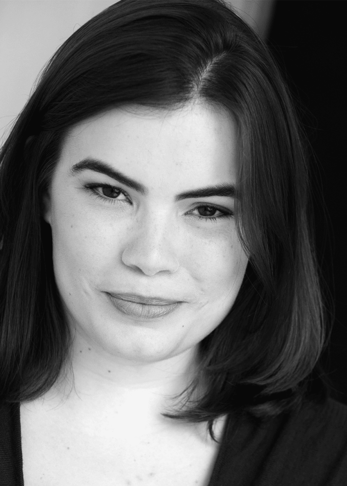 Portrait of Emily Ide, looking at the camera with a slight smile.