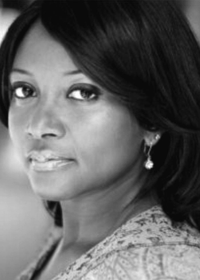 Ebbe Bassey, actress, looking at the camera with a thoughtful expression