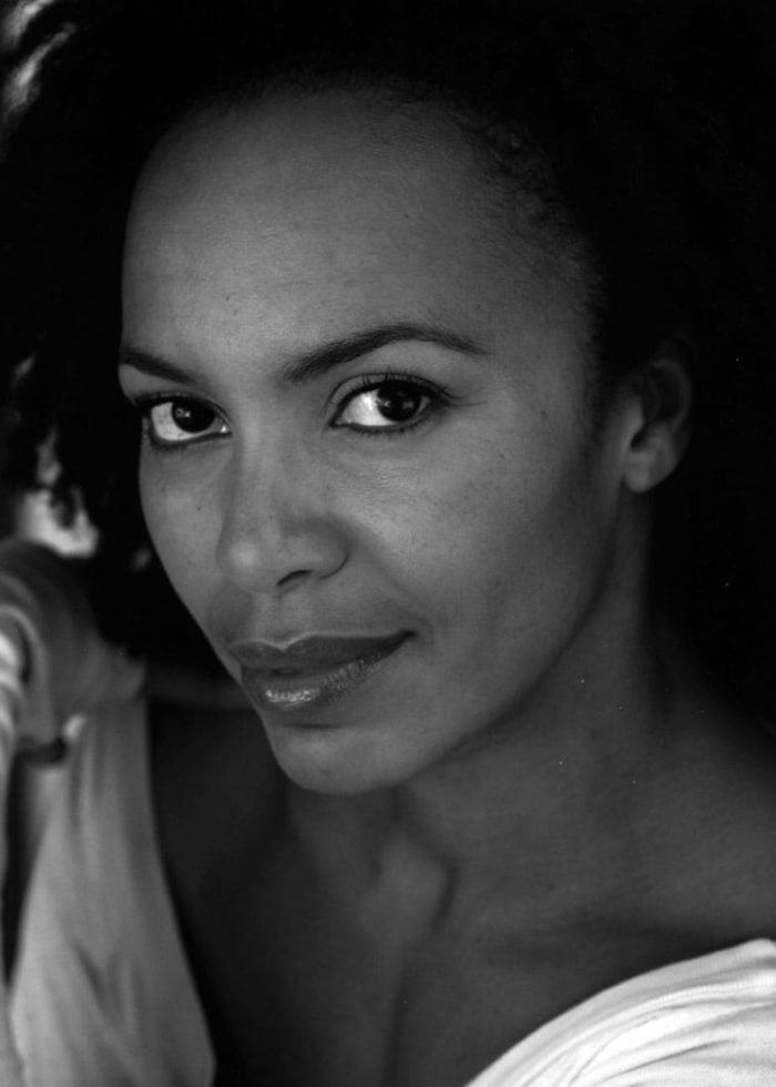 Close-up portrait of Eisa Davis, looking directly at the camera.