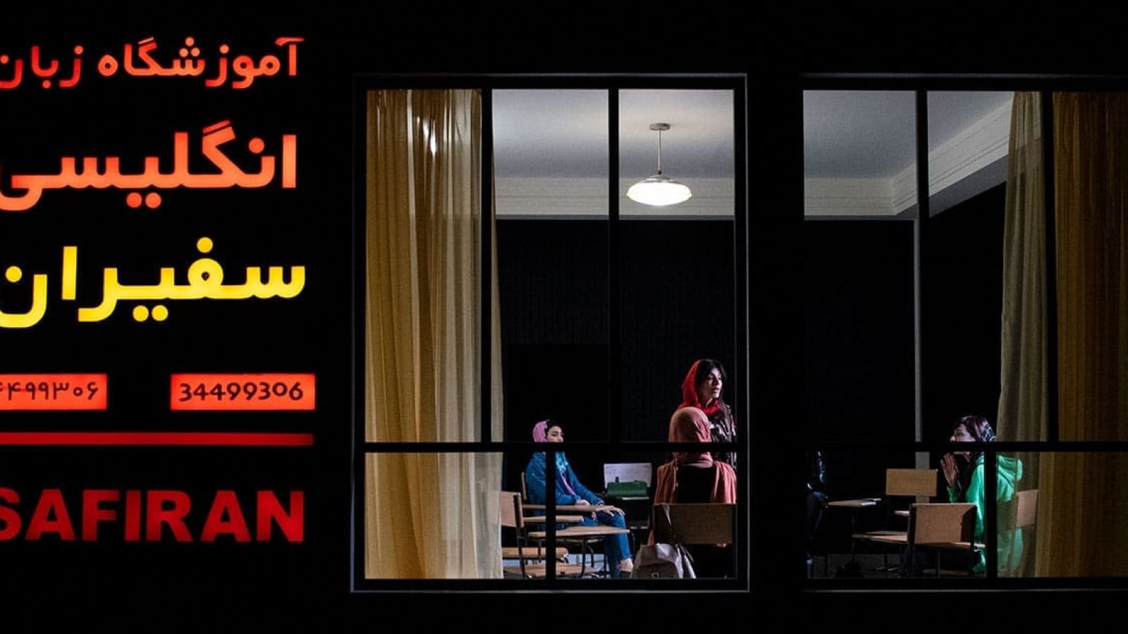 Safiran English Institute in Iran: Women in classroom at night.