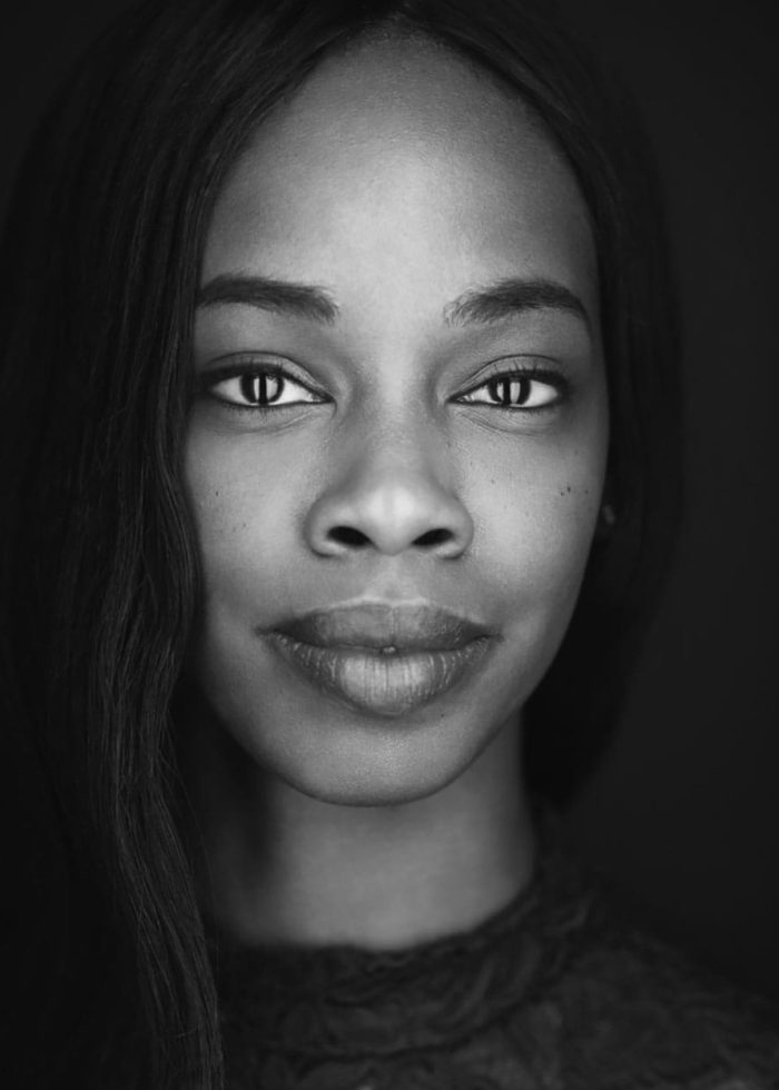 Fedna Jacquet, portrait in black and white, looking directly at the camera.