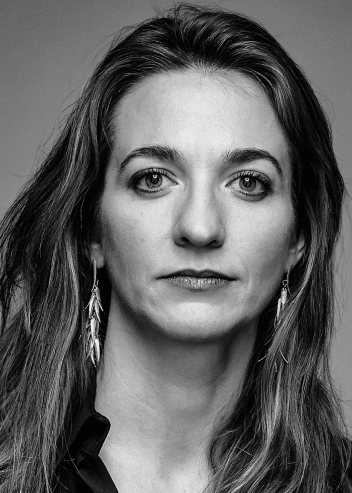 Gaye Taylor Upchurch portrait, looking directly at the camera, wearing earrings