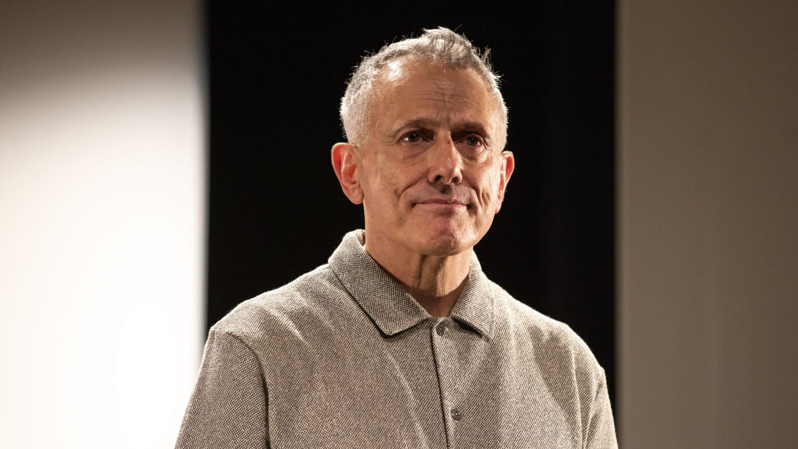 New York Music Photographer Man with gray hair and a button-down shirt looking thoughtfully